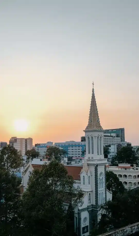 Church steeple against a sunset sky